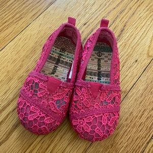Lacy pink slip-on shoes